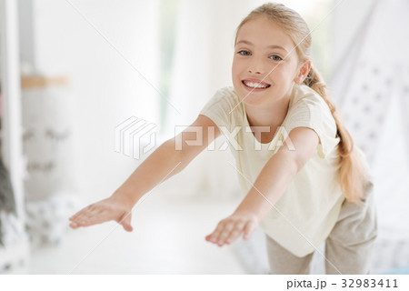 Excited young lady playing sports at home Excited young lady playing sports at home 32983411