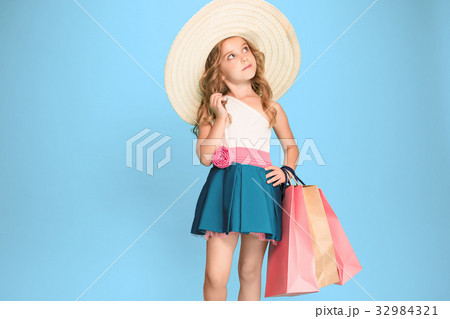 The cute little caucasian brunette girl in dress The cute little caucasian brunette girl in dress 32984321