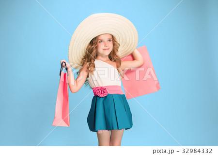 The cute little caucasian brunette girl in dress 32984332