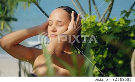 Beautiful young woman in outdoor shower. Sensual 32985689