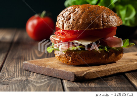 Delicious sandwich with prosciutto ham Delicious sandwich with prosciutto ham 32985712