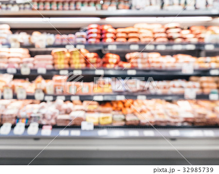 blur of supermarket shelves with refrigerator blur of supermarket shelves with refrigerator 32985739