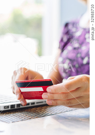 Woman with laptop and credit card in the cafe. Woman with laptop and credit card in the cafe. 32988710