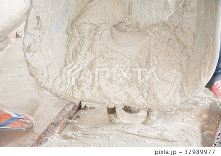 Builders are pouring concrete floors. For construc 32989977