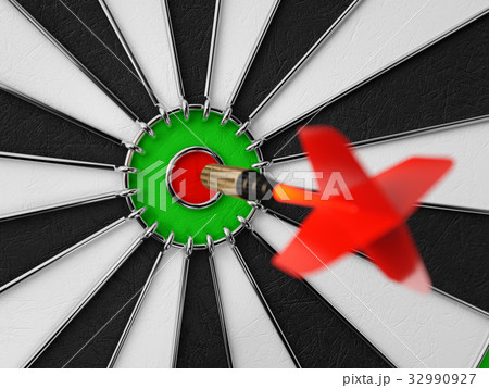 Darts arrow in the target center 32990927