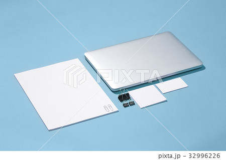 The laptop, pens, phone, note with blank screen on 32996226
