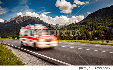 Ambulance van rushes down the highway 32997285