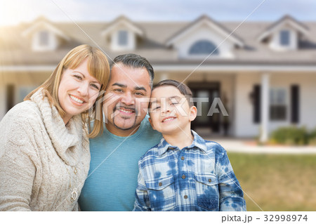Mixed Race Family In Front Yard of Beautiful House and Property. 32998974