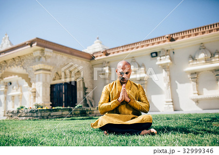 Indian Man Namaste in Gold Kurta at the Temple 32999346