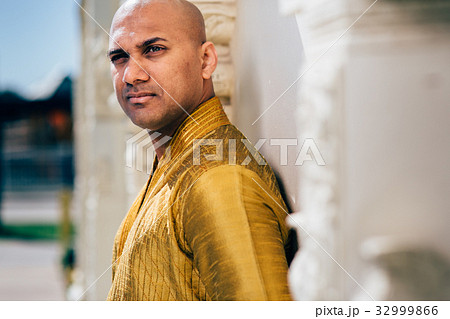 Handsom Indian Man in Gold Kurta at the Temple Handsom Indian Man in Gold Kurta at the Temple 32999866