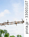 barbed wire on blue sky background 33003107