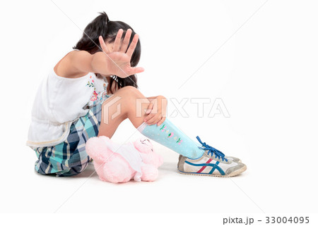 Scared girl making stop gesture with her hand Scared girl making stop gesture with her hand 33004095