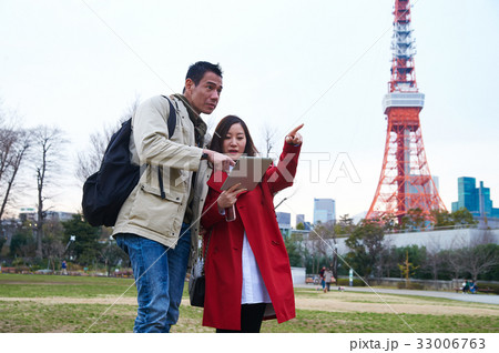 a man is looking something that the girl is pointing 33006763