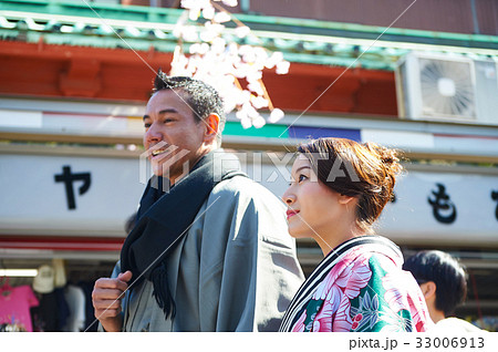A photo of happy couple walking along the downtown in japan 33006913