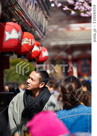 The portrait of the man looking for something on a street 33006939