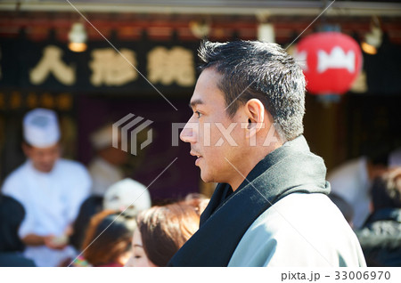 The portrait of a man standing near ramen shop The portrait of a man standing near ramen shop 33006970