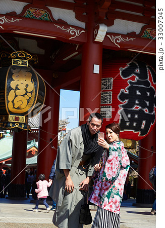 a photo of a couple wearing traditional Japanese clothes, taking selfie a photo of a couple wearing traditional Japanese clothes, taking selfie 33007045