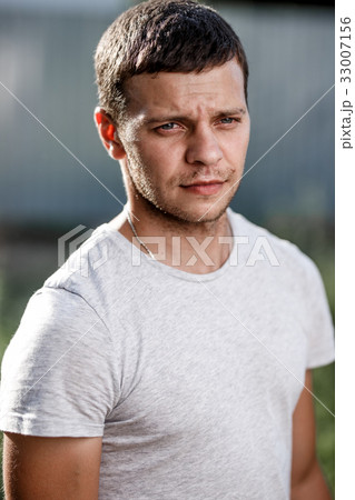 Outdoor portrait of a handsome young man in jeans Outdoor portrait of a handsome young man in jeans 33007156