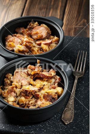 Potatoes baked with sausage and bacon 33010356