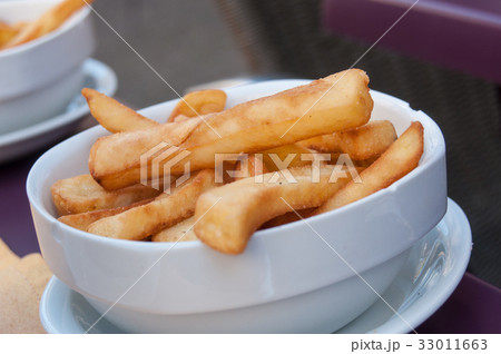 closeup of french fries in a bowl at restaurant closeup of french fries in a bowl at restaurant 33011663