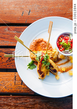 Chicken Satay with peanut sauce Chicken Satay with peanut sauce 33013944