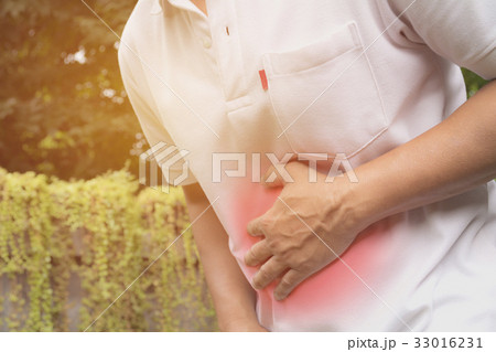 Male suffering from stomachache pain. Male suffering from stomachache pain. 33016231