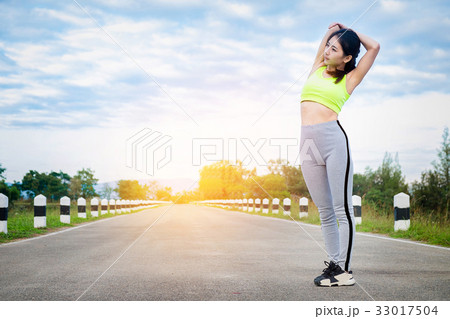 Young woman runner warm up outdoor. Healthy 33017504