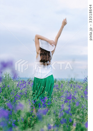 Girl with a bouquet of lavender Girl with a bouquet of lavender 33018644