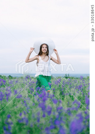 Girl with a bouquet of lavender Girl with a bouquet of lavender 33018645