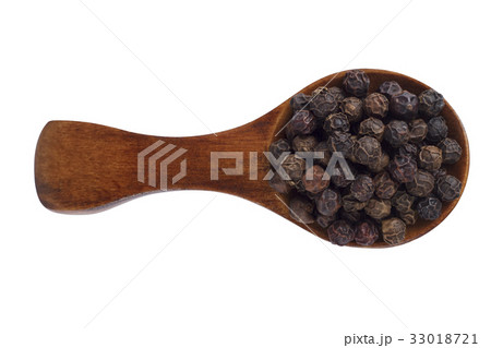 Black pepper in wooden spoon on white background. Black pepper in wooden spoon on white background. 33018721
