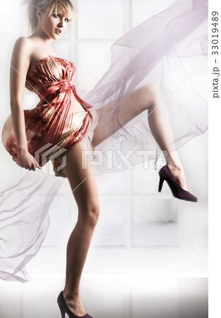 Beautiful girl in a gauzy dress 33019489