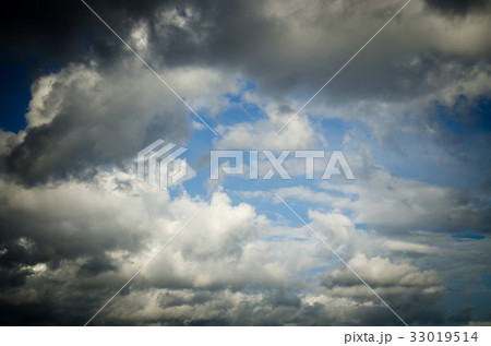 Saturated clouds in the blue sky 33019514