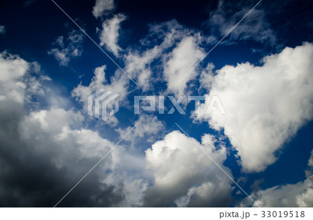 Saturated clouds in the blue sky 33019518