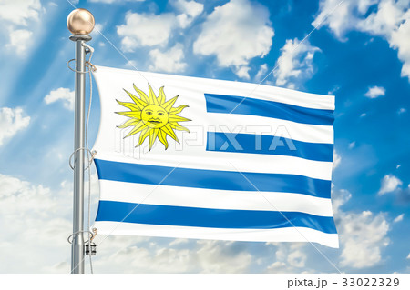Uruguay flag waving in blue cloudy sky Uruguay flag waving in blue cloudy sky 33022329