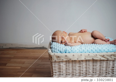 cute newborn baby in the basket cute newborn baby in the basket 33023801