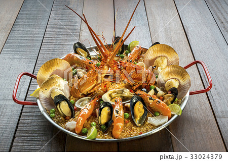 Paella with fresh lobster, scallops, mussel, prawn Paella with fresh lobster, scallops, mussel, prawn 33024379