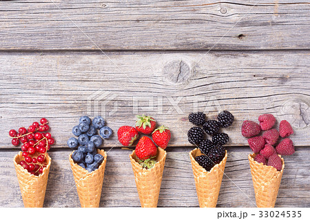 Berries in ice cream cone Berries in ice cream cone 33024535