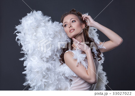 Image of lovely woman in angel costume with wings 33027022