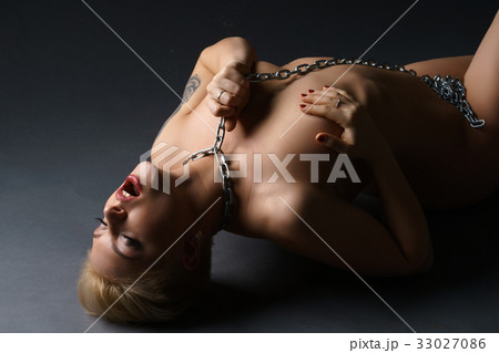 Woman with metal chain on neck getting orgasm 33027086