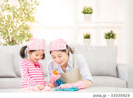 Happy family cleans the living room Happy family cleans the living room 33030929