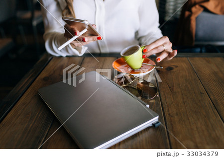 Successful business woman with bad habits 33034379