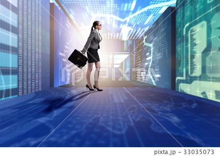 Businesswoman walking in data management concept 33035073