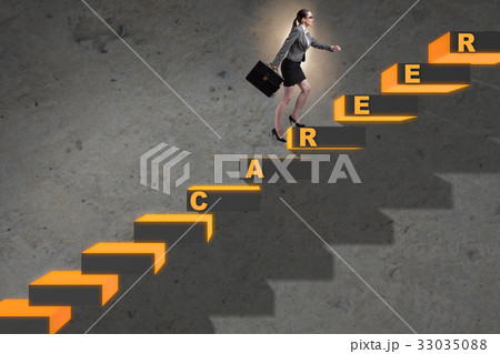 Businesswoman climbing career ladder in business 33035088