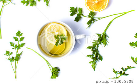 Parsley tea with lemon and lime slices 33035509