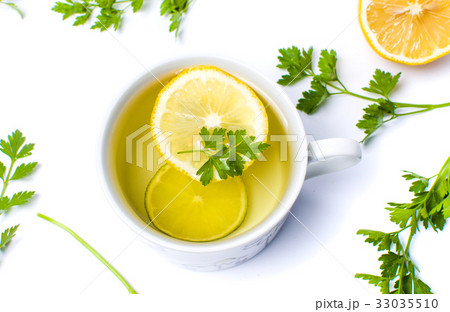 Parsley tea with lemon and lime slices Parsley tea with lemon and lime slices 33035510
