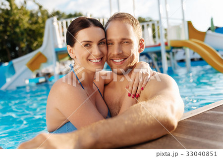 Lovely couple bonding in a swimming pool 33040851