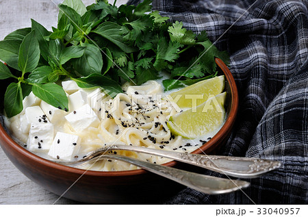 Rice soup with noodles and tofu Rice soup with noodles and tofu 33040957