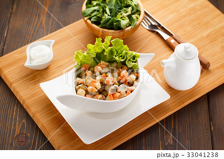 Russian salad Olivier on a white plate 33041238