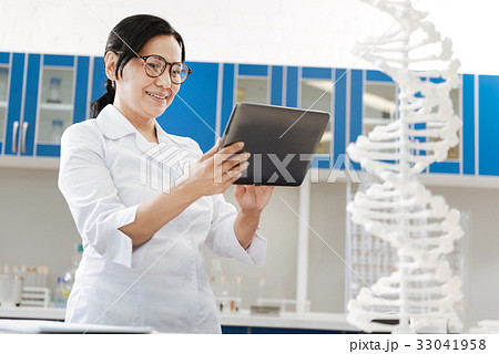 Delighted smart woman doing her job Delighted smart woman doing her job 33041958