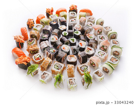 Sushi set for big party. Japanese food on white Sushi set for big party. Japanese food on white 33043240